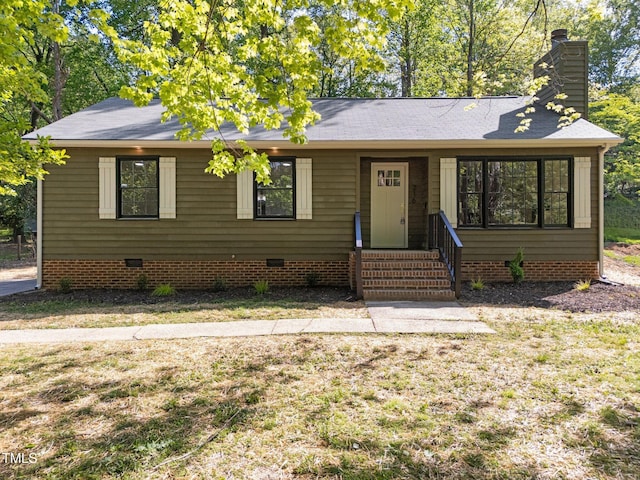 216 Burkwood Ln, Raleigh, NC 27609 - ranch-style home featuring crawl space, a chimney, a front yard, and a shingled roof