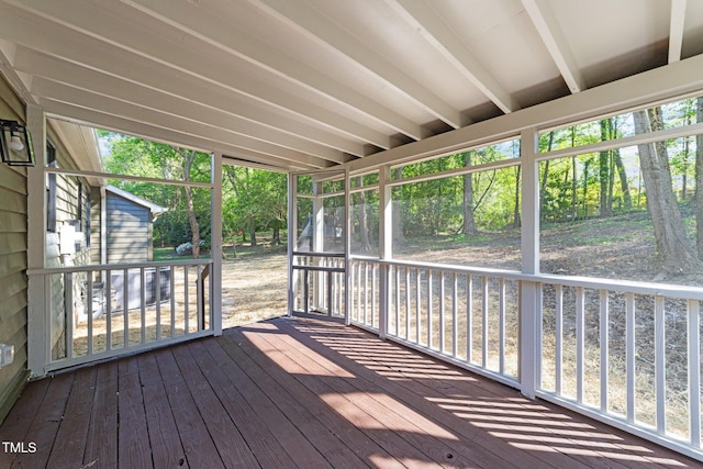 216 Burkwood Ln, Raleigh, NC 27609 - unfurnished sunroom featuring view of wooded area