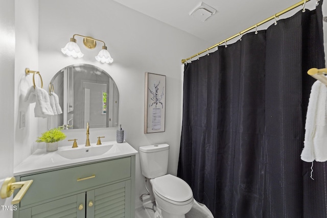 216 Burkwood Ln, Raleigh, NC 27609 - full bathroom featuring vanity, toilet, and a shower with curtain