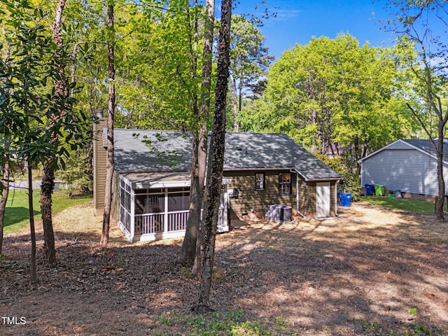 216 Burkwood Ln, Raleigh, NC 27609 - view of outbuilding with a sunroom