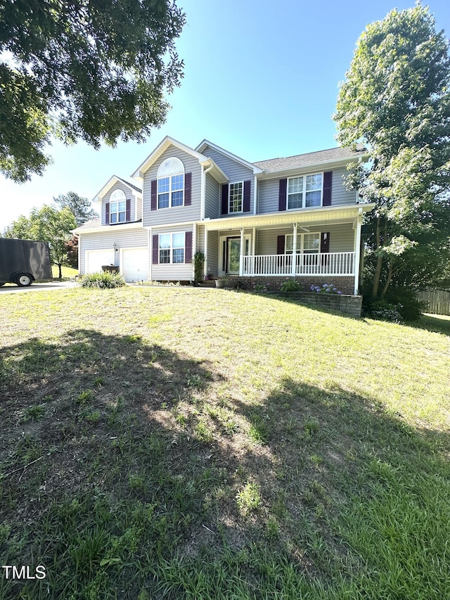 75 Mountainside Ln, Sanford, NC 27332 - view of front of home with a porch, an attached garage, and a front yard