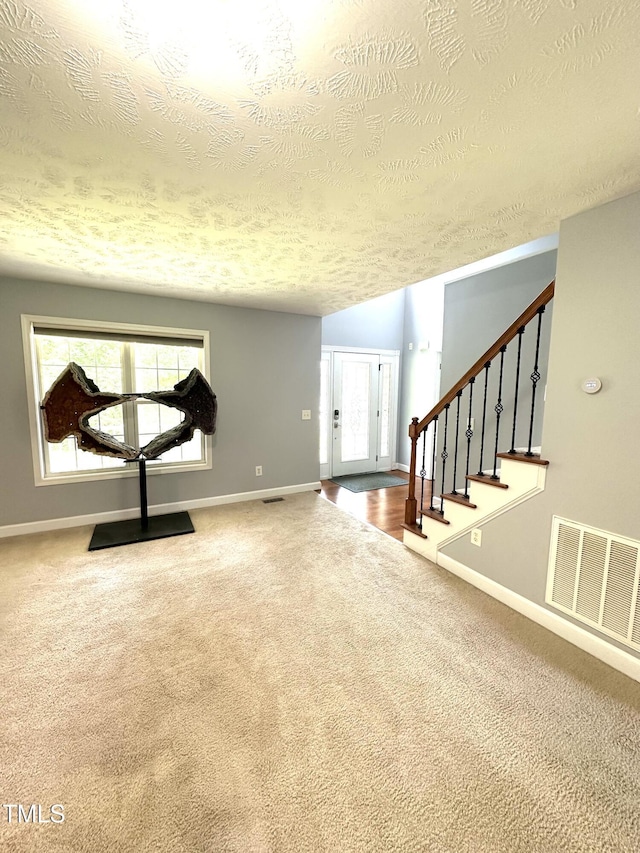 75 Mountainside Ln, Sanford, NC 27332 - workout area featuring a textured ceiling, carpet, and baseboards