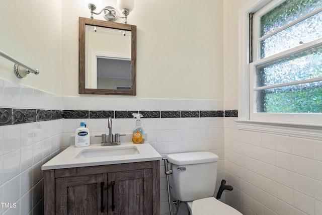 7 Woodward Way, Chapel Hill, NC 27516 - bathroom with toilet, tile walls, healthy amount of natural light, vanity, and wainscoting