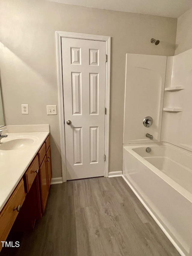 7832 Averette Field Dr, Raleigh, NC 27616 - bathroom with vanity, wood finished floors, bathtub / shower combination, and baseboards