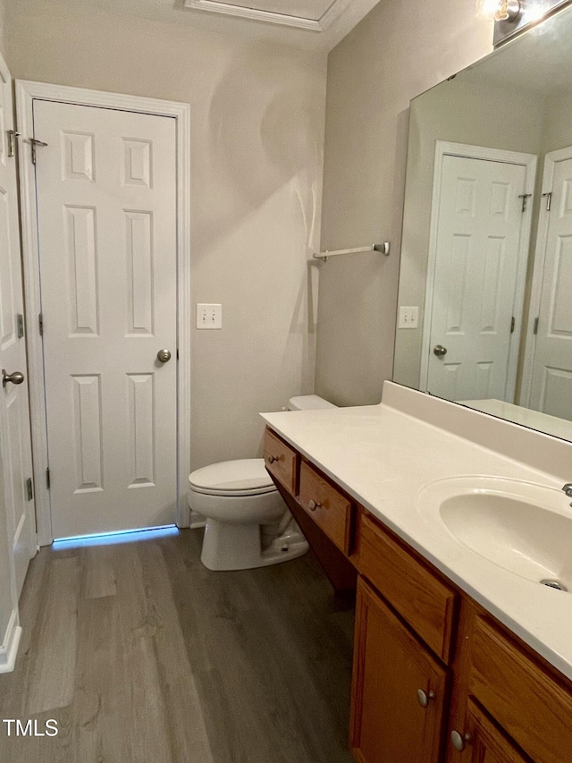 7832 Averette Field Dr, Raleigh, NC 27616 - bathroom featuring wood finished floors, vanity, and toilet