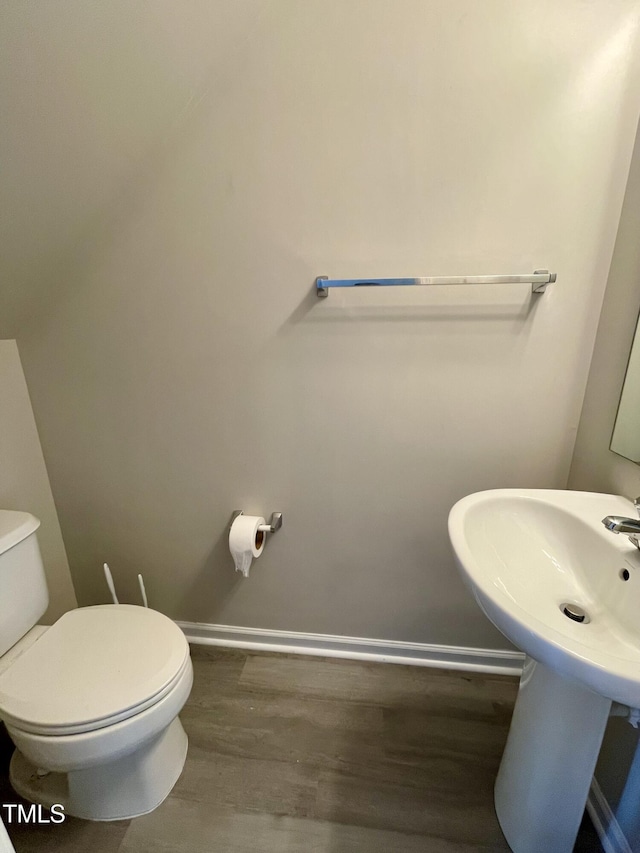 7832 Averette Field Dr, Raleigh, NC 27616 - bathroom with wood finished floors, toilet, and baseboards