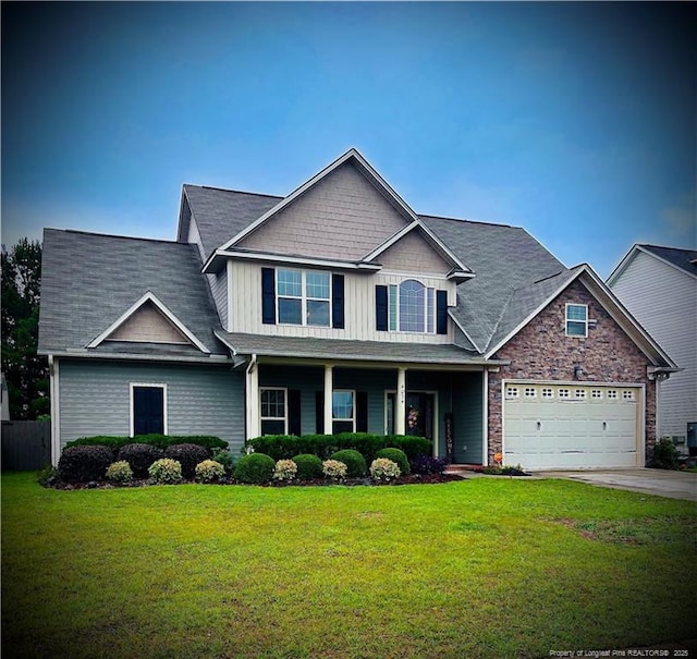 4034 Pleasantburg Dr, Fayetteville, NC 28312 - craftsman-style house with concrete driveway, a front yard, board and batten siding, a garage, and covered porch