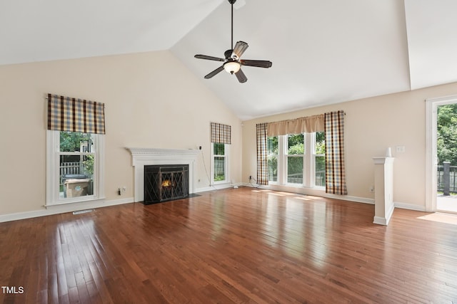 304 Cayman Ave, Holly Springs, NC 27540 - unfurnished living room featuring a fireplace with flush hearth, high vaulted ceiling, hardwood / wood-style floors, a ceiling fan, and baseboards
