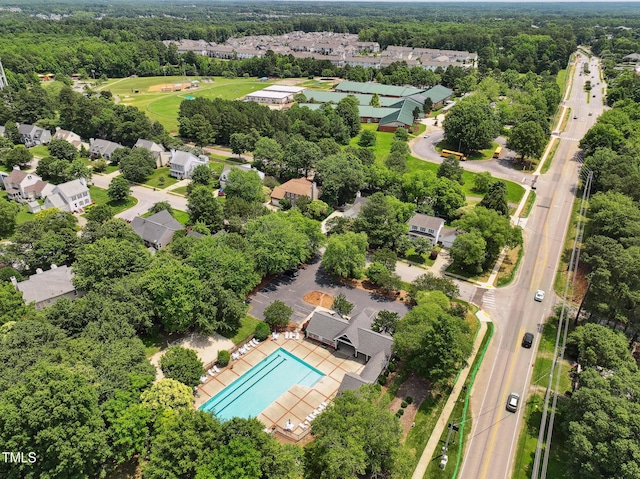 304 Cayman Ave, Holly Springs, NC 27540 - aerial perspective of suburban area with a pool area