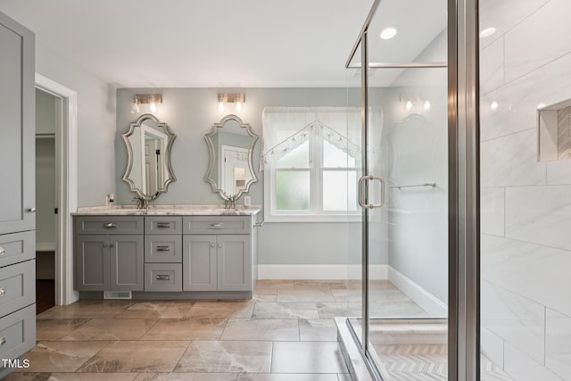 304 Cayman Ave, Holly Springs, NC 27540 - bathroom featuring double vanity, a stall shower, baseboards, and recessed lighting