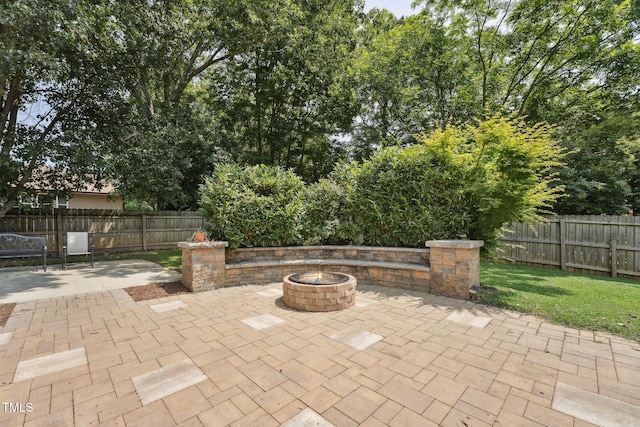 304 Cayman Ave, Holly Springs, NC 27540 - fenced backyard featuring a patio area and a fire pit