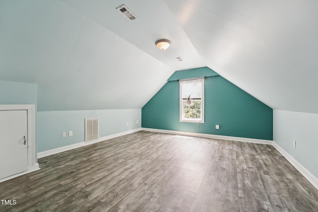304 Cayman Ave, Holly Springs, NC 27540 - bonus room featuring wood finished floors, baseboards, and vaulted ceiling