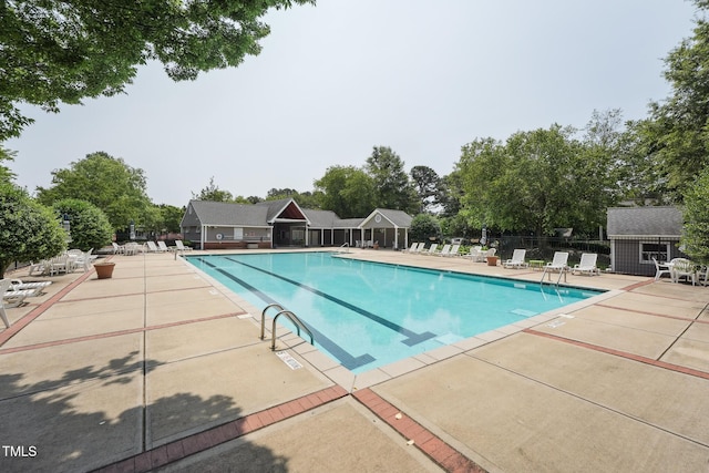 304 Cayman Ave, Holly Springs, NC 27540 - community pool featuring a patio area