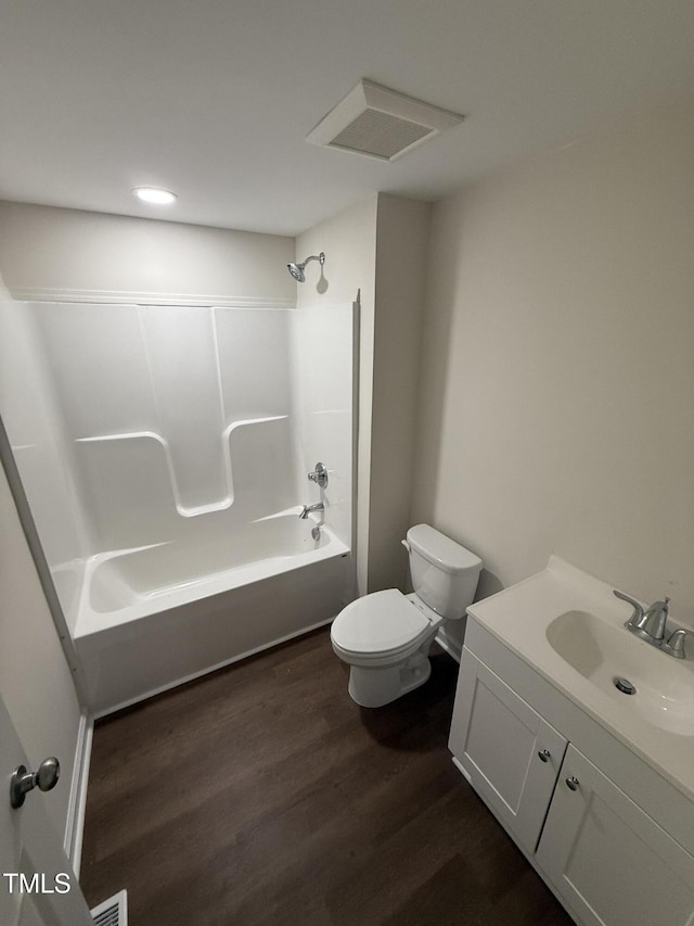 203 Hope St, Erwin, NC 28339 - bathroom with tub / shower combination, vanity, wood finished floors, and recessed lighting