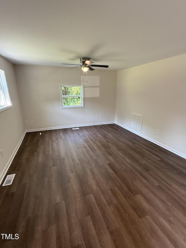 203 Hope St, Erwin, NC 28339 - empty room featuring dark wood-style floors and a ceiling fan