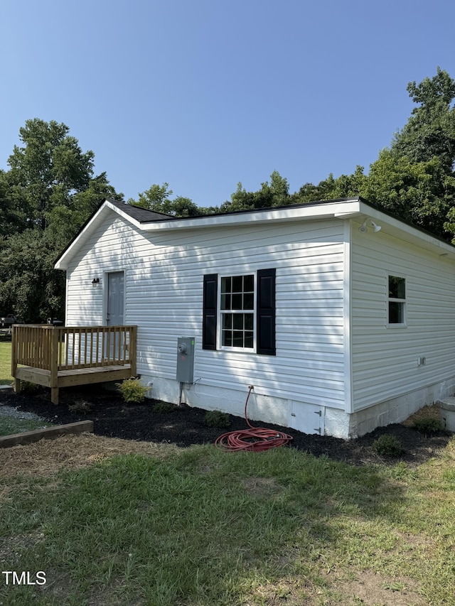 203 Hope St, Erwin, NC 28339 - rear view of house featuring a deck and a yard