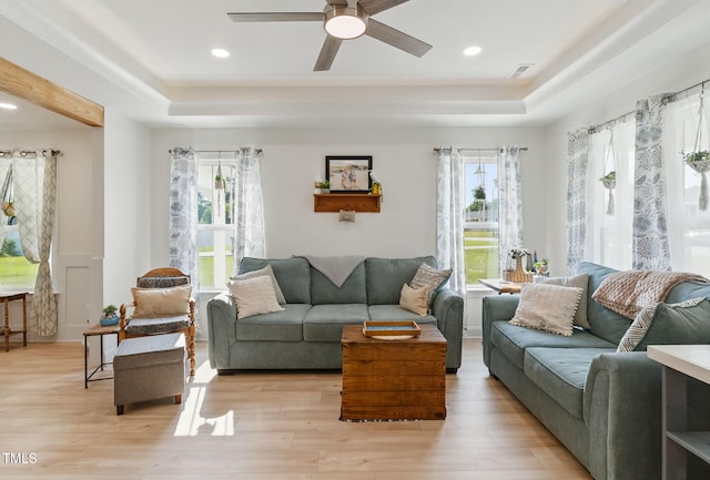 221 Moon Cir, Dunn, NC 28334 - living room with a raised ceiling, healthy amount of natural light, a ceiling fan, and recessed lighting