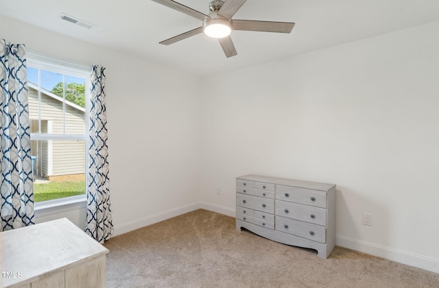 221 Moon Cir, Dunn, NC 28334 - unfurnished bedroom with carpet, baseboards, and a ceiling fan