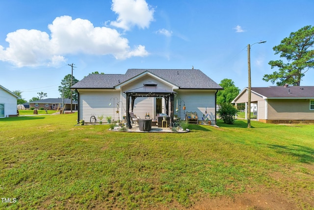 221 Moon Cir, Dunn, NC 28334 - rear view of property with a gazebo, a lawn, a patio area, and a shingled roof