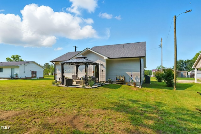 221 Moon Cir, Dunn, NC 28334 - rear view of property with a gazebo, a yard, a patio area, and roof with shingles