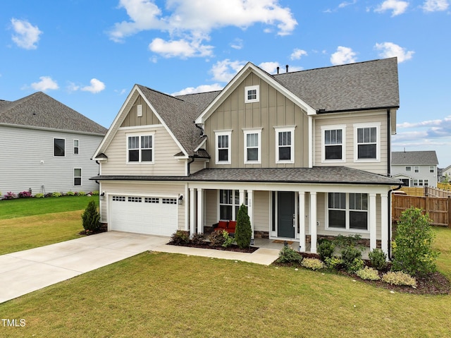 200 Cloud Berry Ln, Holly Springs, NC 27540 - view of front of home featuring board and batten siding, concrete driveway, an attached garage, and a porch