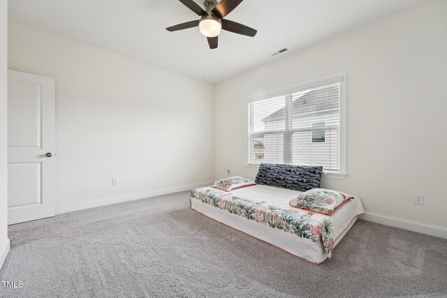 200 Cloud Berry Ln, Holly Springs, NC 27540 - carpeted bedroom featuring baseboards and a ceiling fan