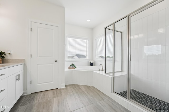 200 Cloud Berry Ln, Holly Springs, NC 27540 - full bathroom with a garden tub, vanity, and a stall shower