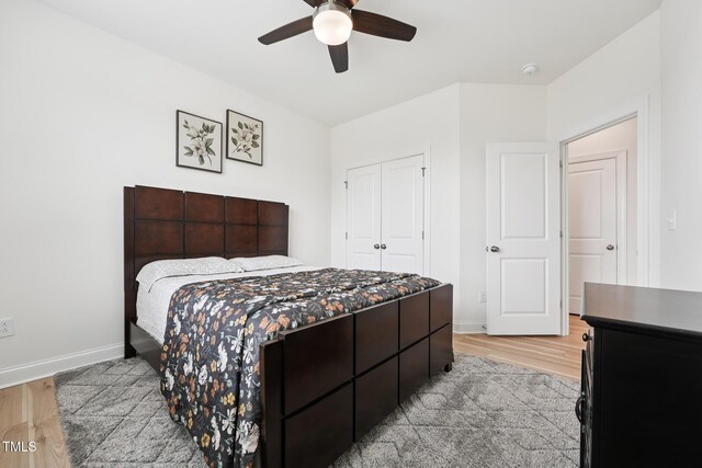 200 Cloud Berry Ln, Holly Springs, NC 27540 - bedroom with light wood-style flooring, baseboards, a closet, and a ceiling fan