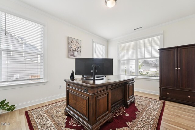 200 Cloud Berry Ln, Holly Springs, NC 27540 - home office featuring plenty of natural light, ornamental molding, light wood finished floors, and baseboards