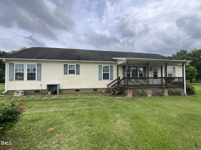 2590 George Winston Rd, Bullock, NC 27507 - rear view of property with crawl space, a porch, a lawn, and roof with shingles