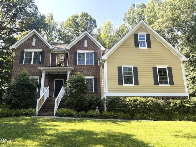 3650 Pleasants Ridge Dr, Wake Forest, NC 27587 - view of front of house featuring a front yard and brick siding
