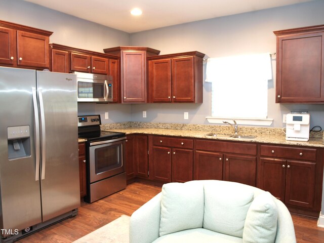 3650 Pleasants Ridge Dr, Wake Forest, NC 27587 - kitchen with stainless steel appliances, a sink, dark wood-style flooring, light stone countertops, and recessed lighting
