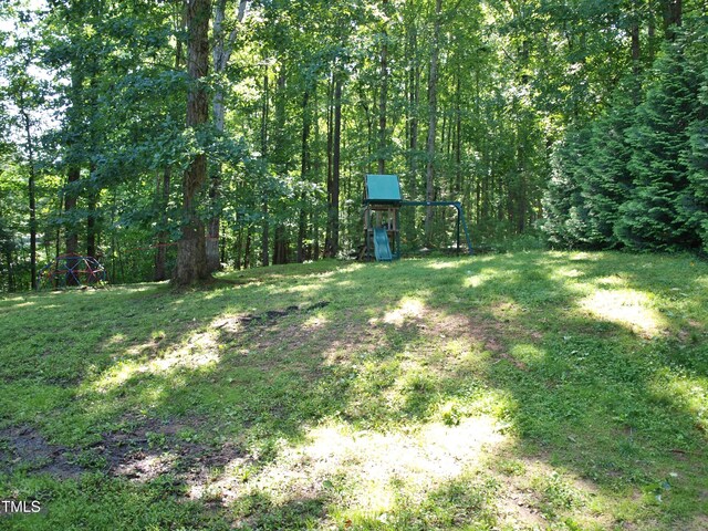 3650 Pleasants Ridge Dr, Wake Forest, NC 27587 - view of grassy yard featuring a view of trees