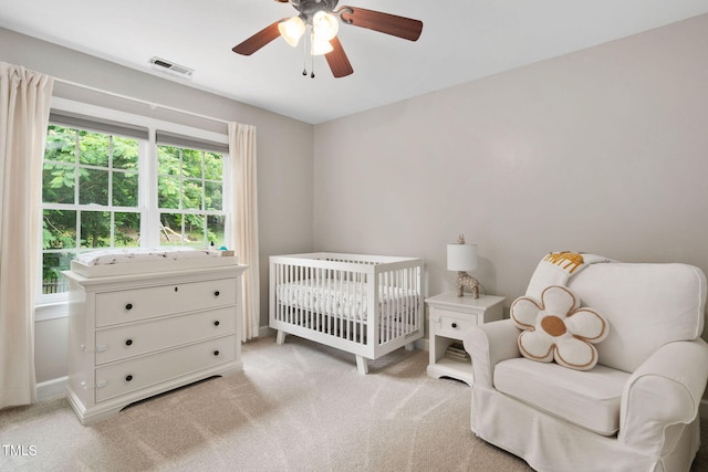 8201 Ivymount Way, Raleigh, NC 27613 - carpeted bedroom featuring a ceiling fan and a nursery area