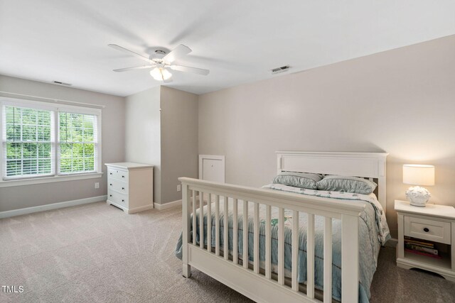 8201 Ivymount Way, Raleigh, NC 27613 - bedroom featuring light colored carpet, baseboards, and ceiling fan