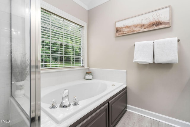 8201 Ivymount Way, Raleigh, NC 27613 - full bathroom featuring a tub, healthy amount of natural light, ornamental molding, a shower, and baseboards