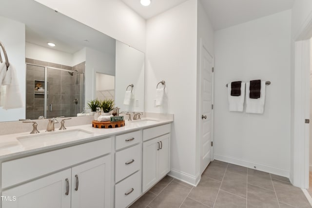 142 N White St # 100, Wake Forest, NC 27587 - bathroom with double vanity, a shower stall, tile patterned flooring, baseboards, and recessed lighting