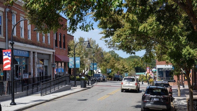 142 N White St # 100, Wake Forest, NC 27587 - view of asphalt road featuring sidewalks, street lighting, and curbs