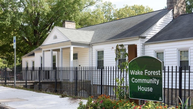142 N White St # 100, Wake Forest, NC 27587 - view of front of home with a chimney