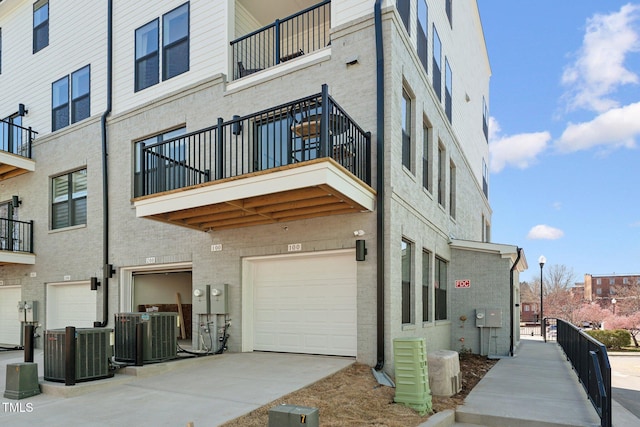 142 N White St # 100, Wake Forest, NC 27587 - view of property featuring central AC unit, concrete driveway, and a garage