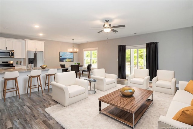3029 Candlelight Dr, Fayetteville, NC 28311 - living room with a chandelier, healthy amount of natural light, dark wood-style floors, ceiling fan, and recessed lighting