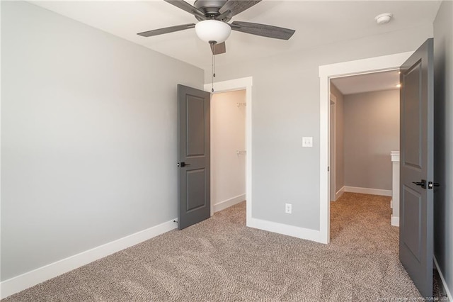 3029 Candlelight Dr, Fayetteville, NC 28311 - unfurnished bedroom featuring light colored carpet, baseboards, and a spacious closet