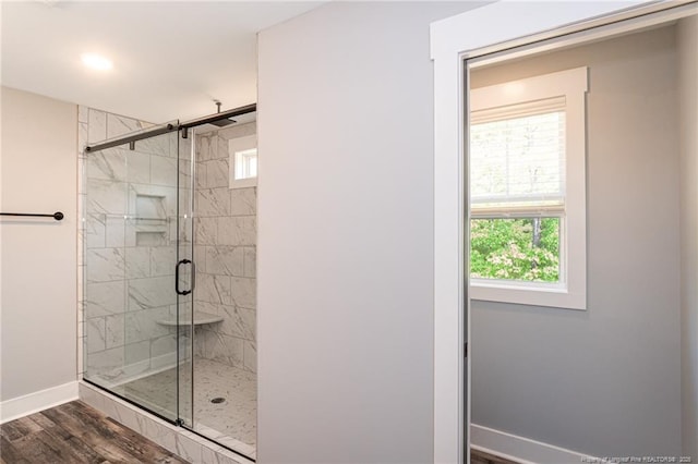 3029 Candlelight Dr, Fayetteville, NC 28311 - full bath with plenty of natural light, a stall shower, baseboards, and wood finished floors