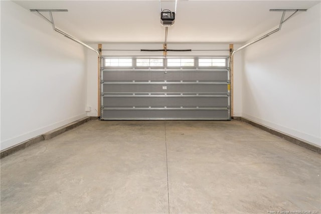 3029 Candlelight Dr, Fayetteville, NC 28311 - garage featuring baseboards and a garage door opener