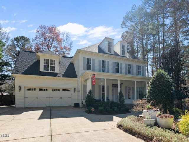 1006 Henny Pl, Raleigh, NC 27614 - view of front facade with concrete driveway, a garage, covered porch, and roof with shingles
