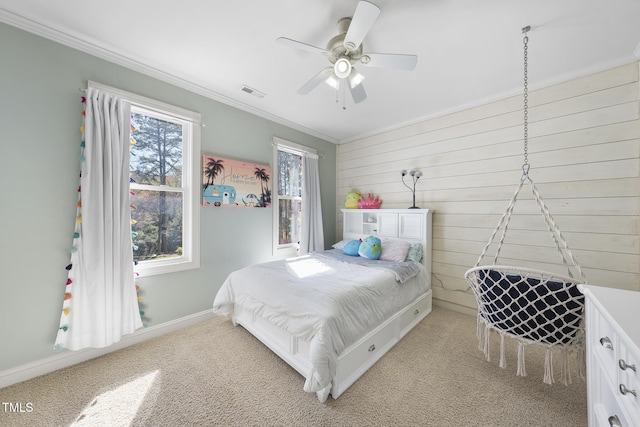1006 Henny Pl, Raleigh, NC 27614 - bedroom featuring ornamental molding, light carpet, wood walls, baseboards, and a ceiling fan