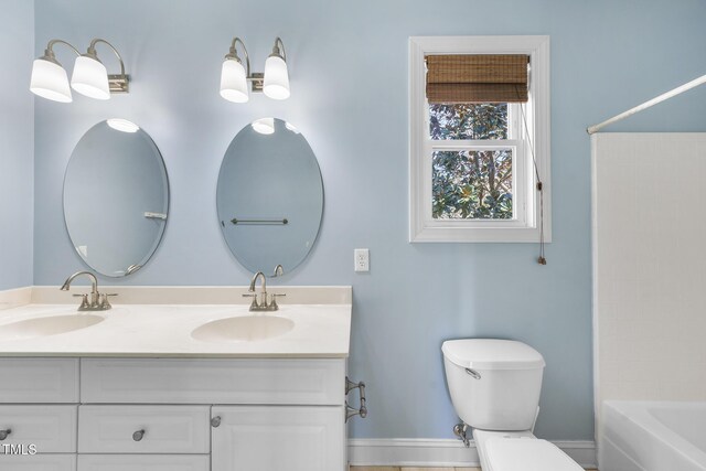 1006 Henny Pl, Raleigh, NC 27614 - full bath featuring double vanity, toilet, and bathing tub / shower combination