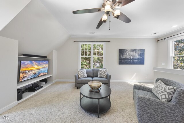 1006 Henny Pl, Raleigh, NC 27614 - carpeted living area with healthy amount of natural light, baseboards, vaulted ceiling, ceiling fan, and crown molding