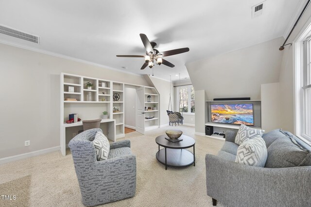 1006 Henny Pl, Raleigh, NC 27614 - living area featuring a ceiling fan, carpet floors, baseboards, crown molding, and a desk