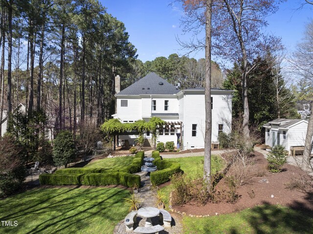 1006 Henny Pl, Raleigh, NC 27614 - rear view of property featuring a chimney, a yard, and stairs
